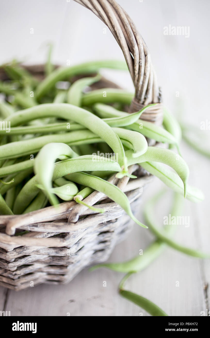 Group of green beans on white table Stock Photo