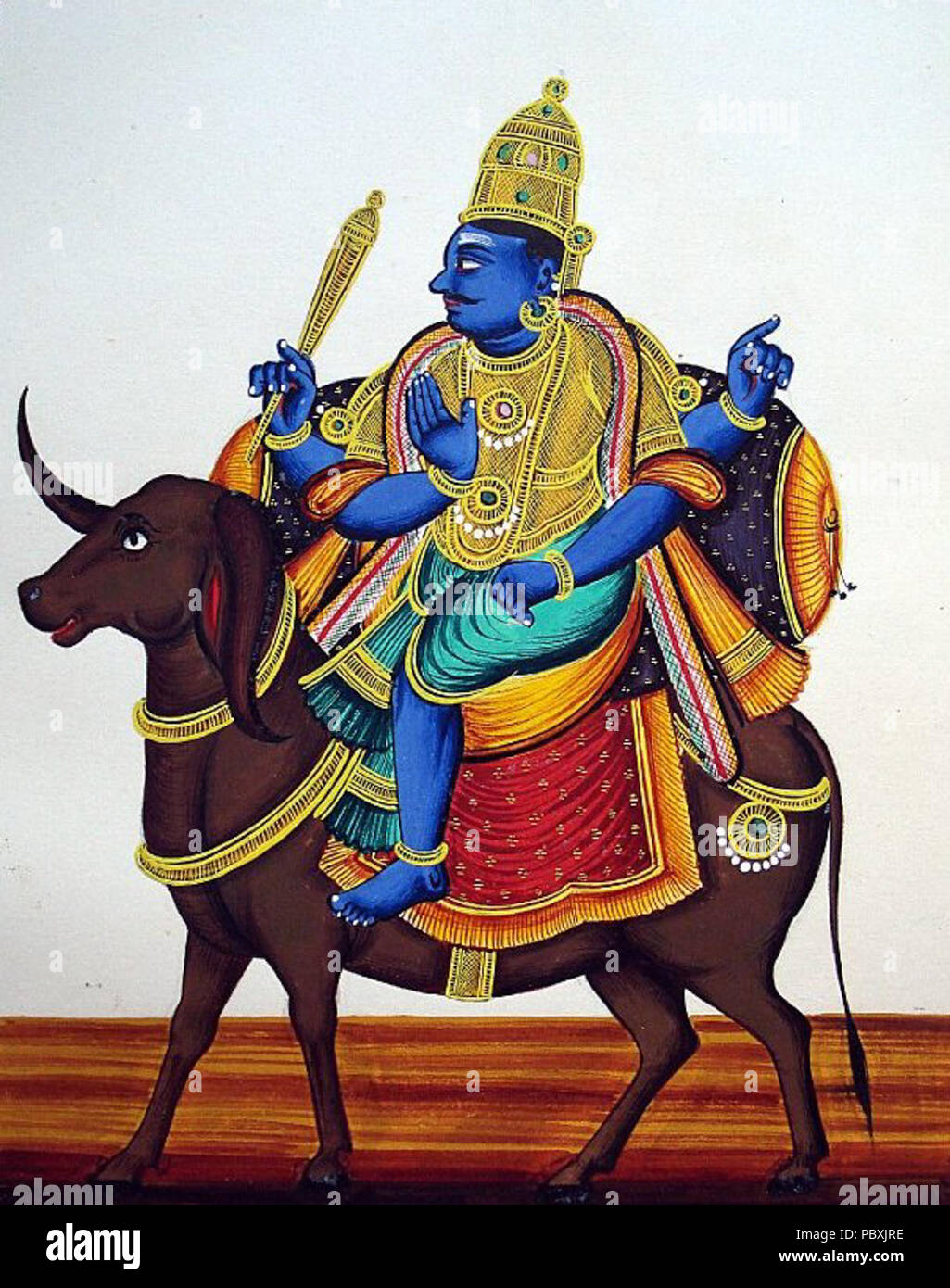 214 Four-armed and dark-complexioned Yama rides on his bejewelled and caparisoned buffalo. In his upper right hand is the danda (staff) (cropped) Stock Photo