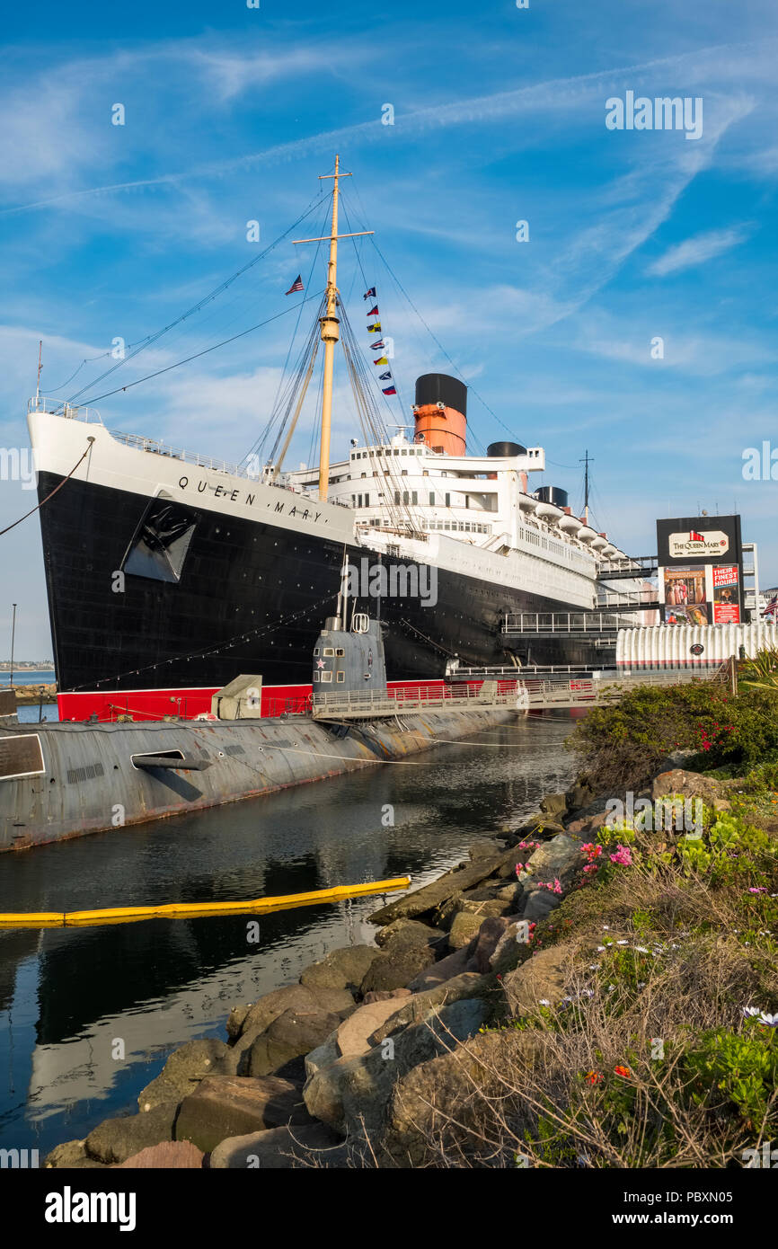 The Queen Mary ship, now a museum and major tourist attraction with Russian submarine the Scorpion docked beside it, in Long Beach, California, CA, US Stock Photo