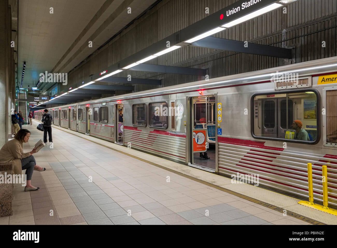 Subway train and passengers on a platform in the LA Metro, Los Angeles, California, CA, USA Stock Photo
