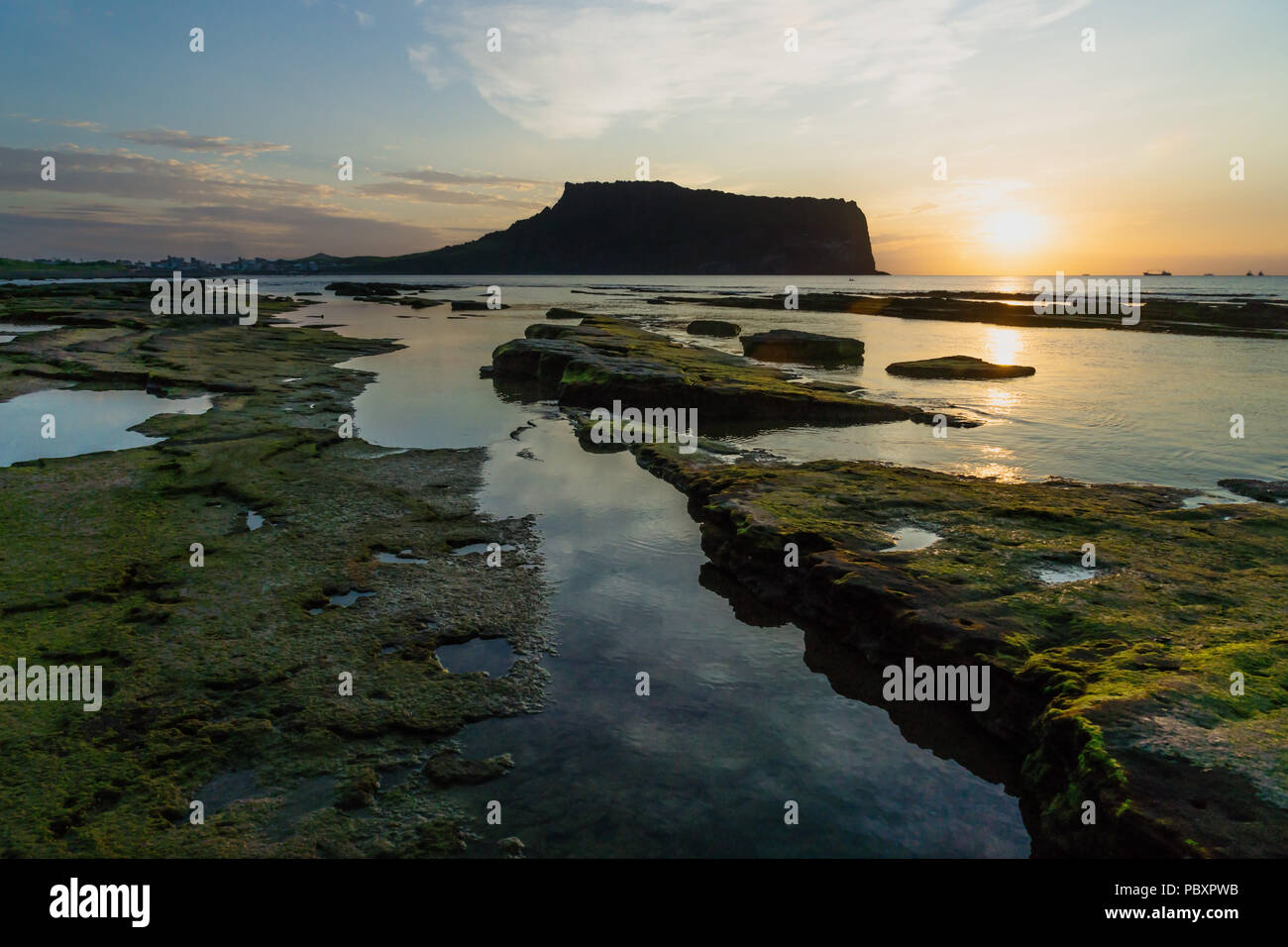 Before Sunrise at Ilchulbong volcano crater with view over ocean and