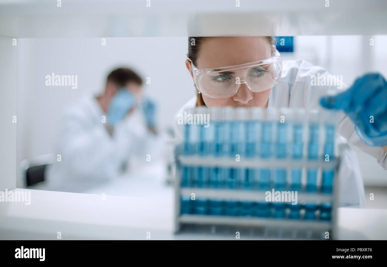 close up.scientist with vial Stock Photo Alamy
