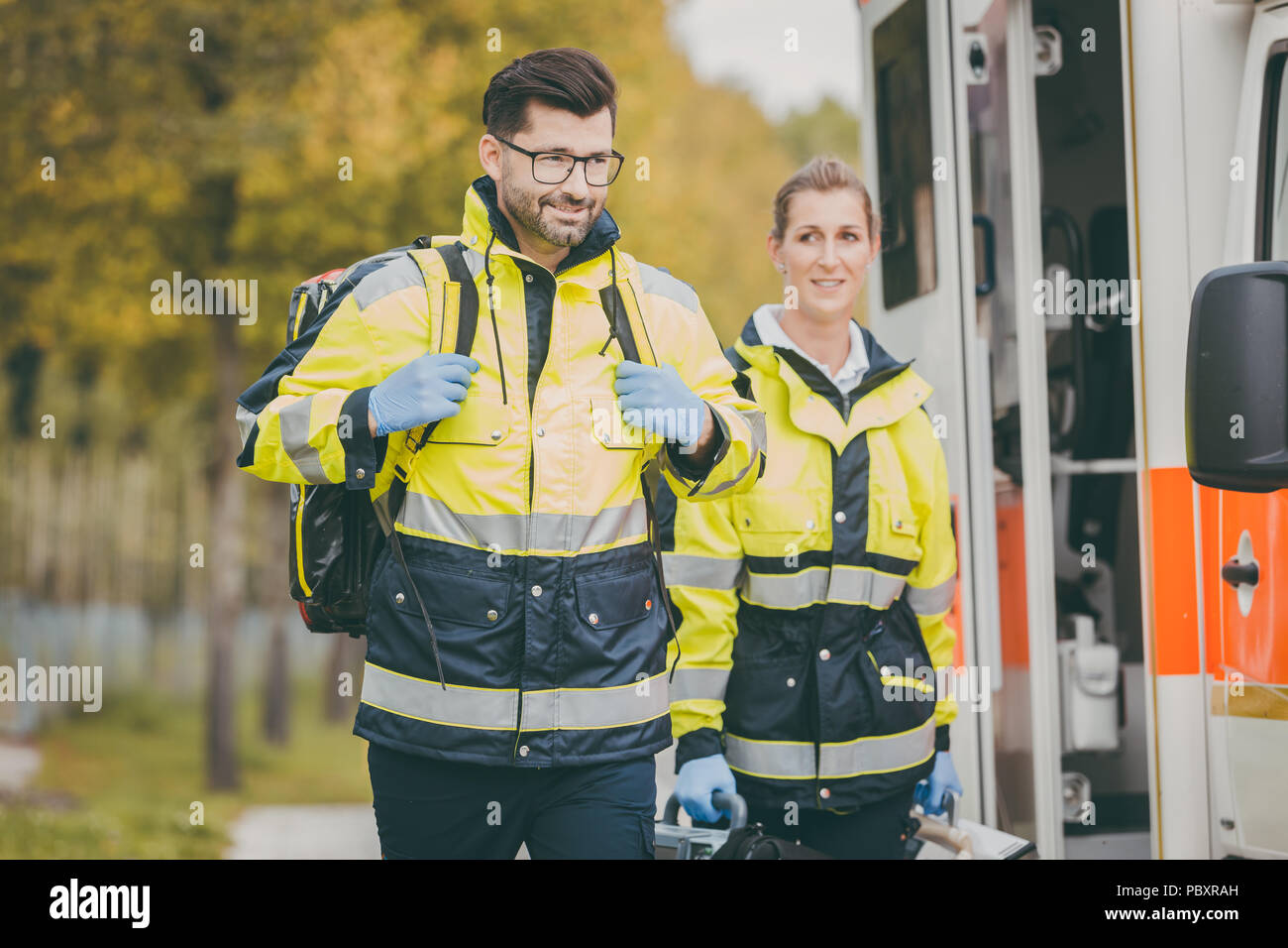 Paramedic nurse and emergency doctor at ambulance Stock Photo