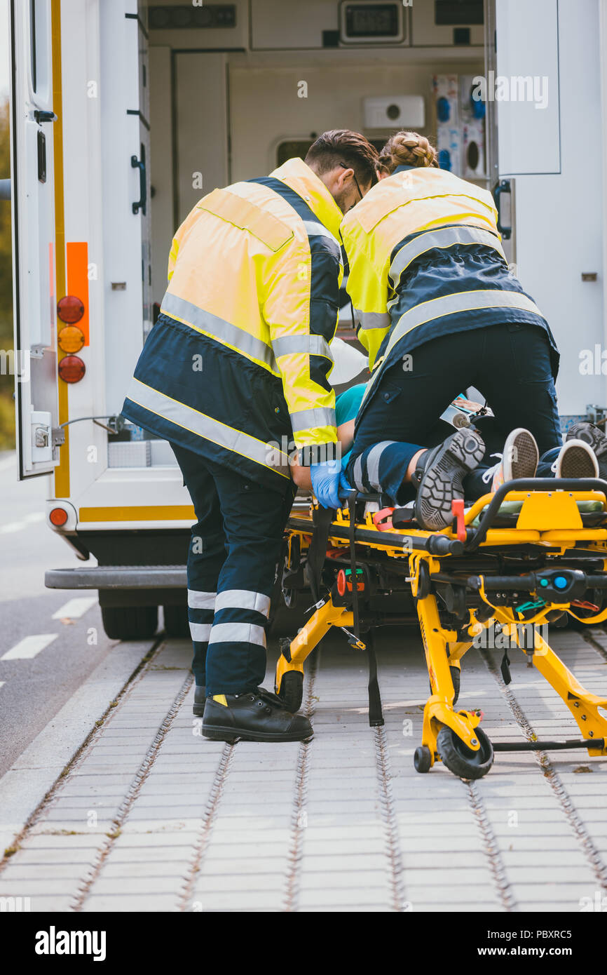 Injured woman on stretcher hi-res stock photography and images - Alamy