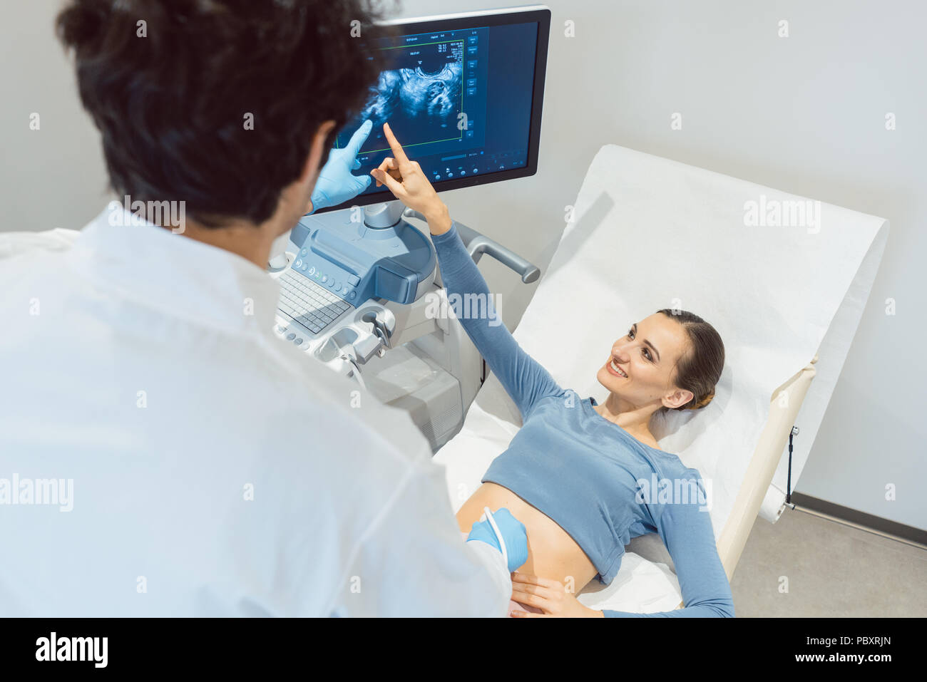 Doctor gynecologist and woman in ultrasonic pregnancy test Stock Photo Alamy