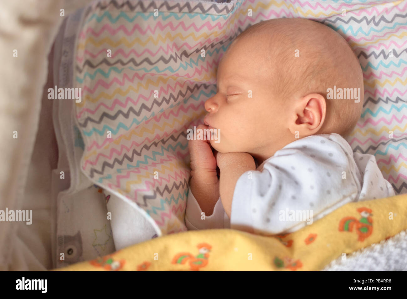 baby sleeping on side newborn