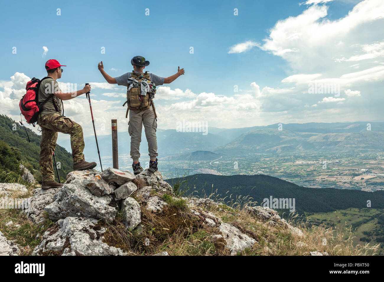 Young trekkers in  the mountain top, Abruzzo Stock Photo