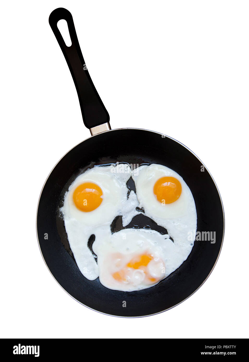 Eggs fried on a pan as a smile. Isolated on a white background with path. Stock Photo