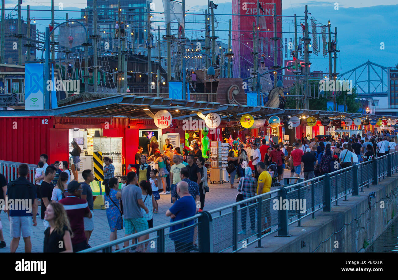 Montreal, Canada, 29 July, 2018. People walking along shops and boutiques at the Bonsecours bassin in Old Montreal. Credit:Mario Beauregard/Alamy Live Stock Photo