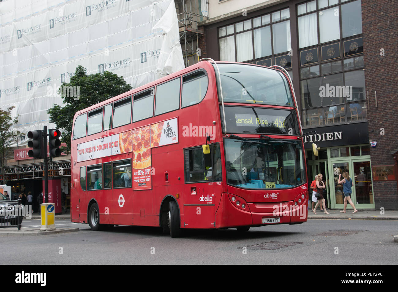 An Alexander Dennis Enviro400 opertaed by Abellio on behalf of Transport for London on route 452 has just passed Notting Hill Gate station and is head Stock Photo