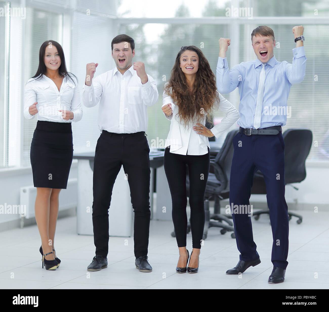 portrait of a triumphant business team Stock Photo - Alamy