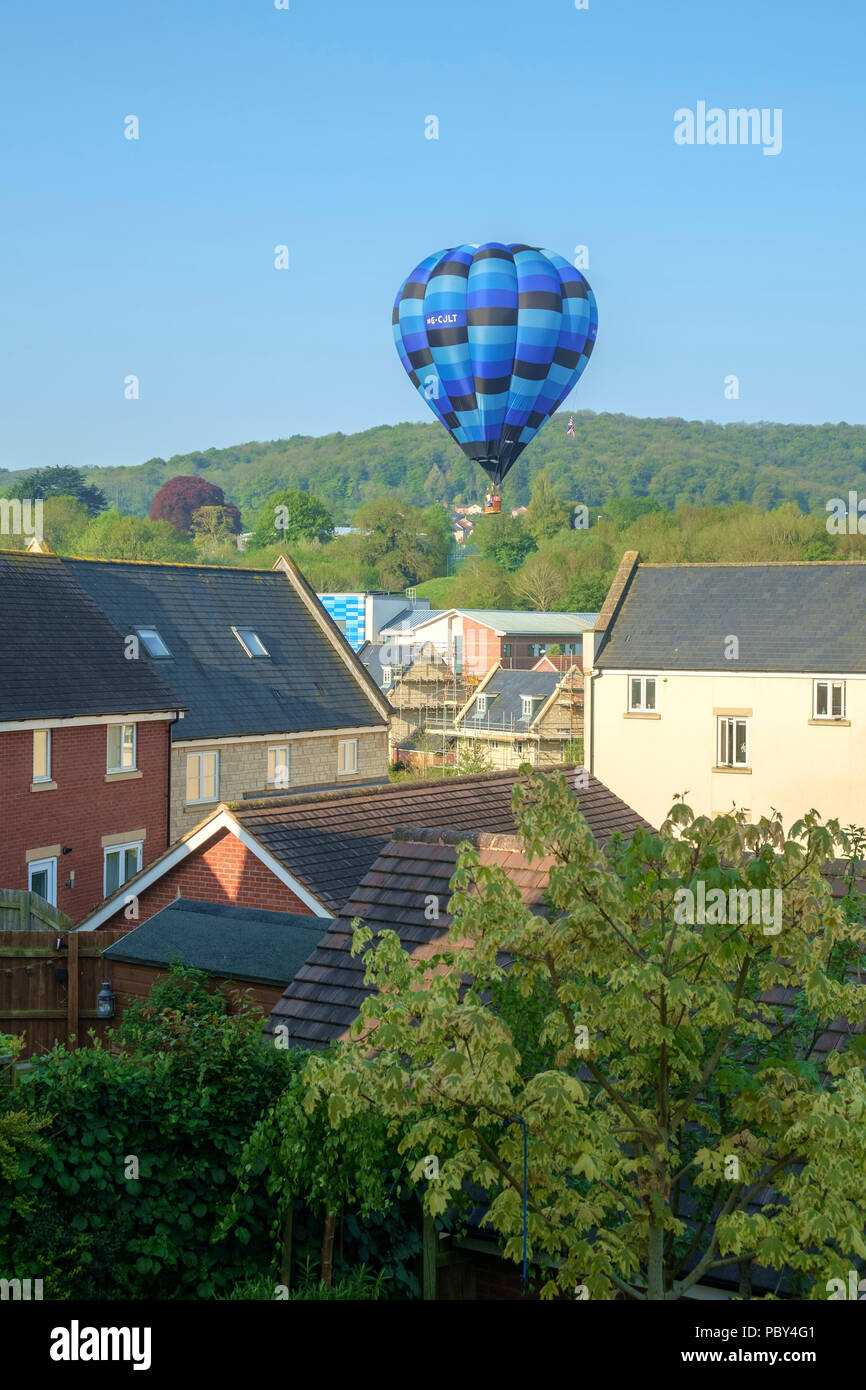 Dursley, Gloucestershire, UK - 7th May 2018: A hot air balloon makes an unplanned but safe landing in a housing estate street in Dursley, Gloucestershire, UK. Stock Photo