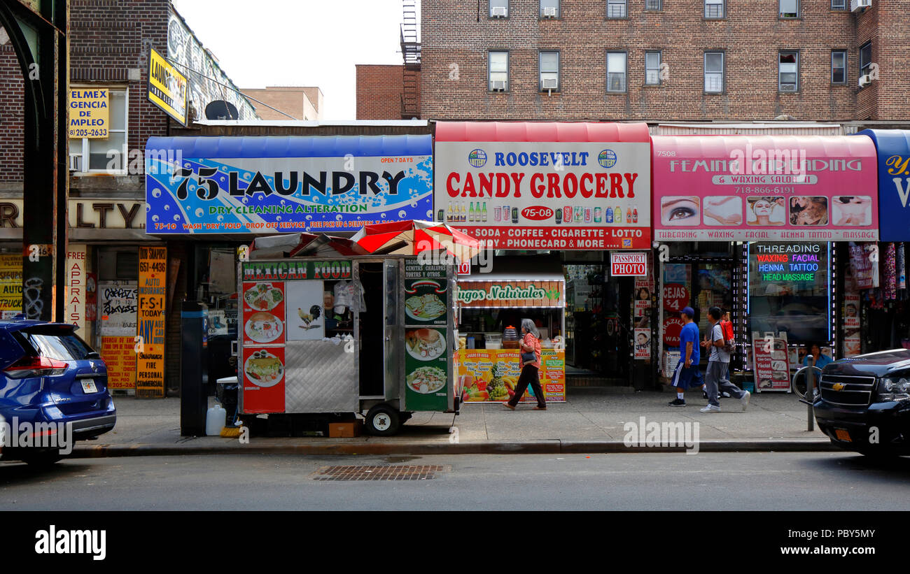 Various shops and storefronts under the elevated subway line on Roosevelt Ave, Jackson Heights, New York, NY. Stock Photo