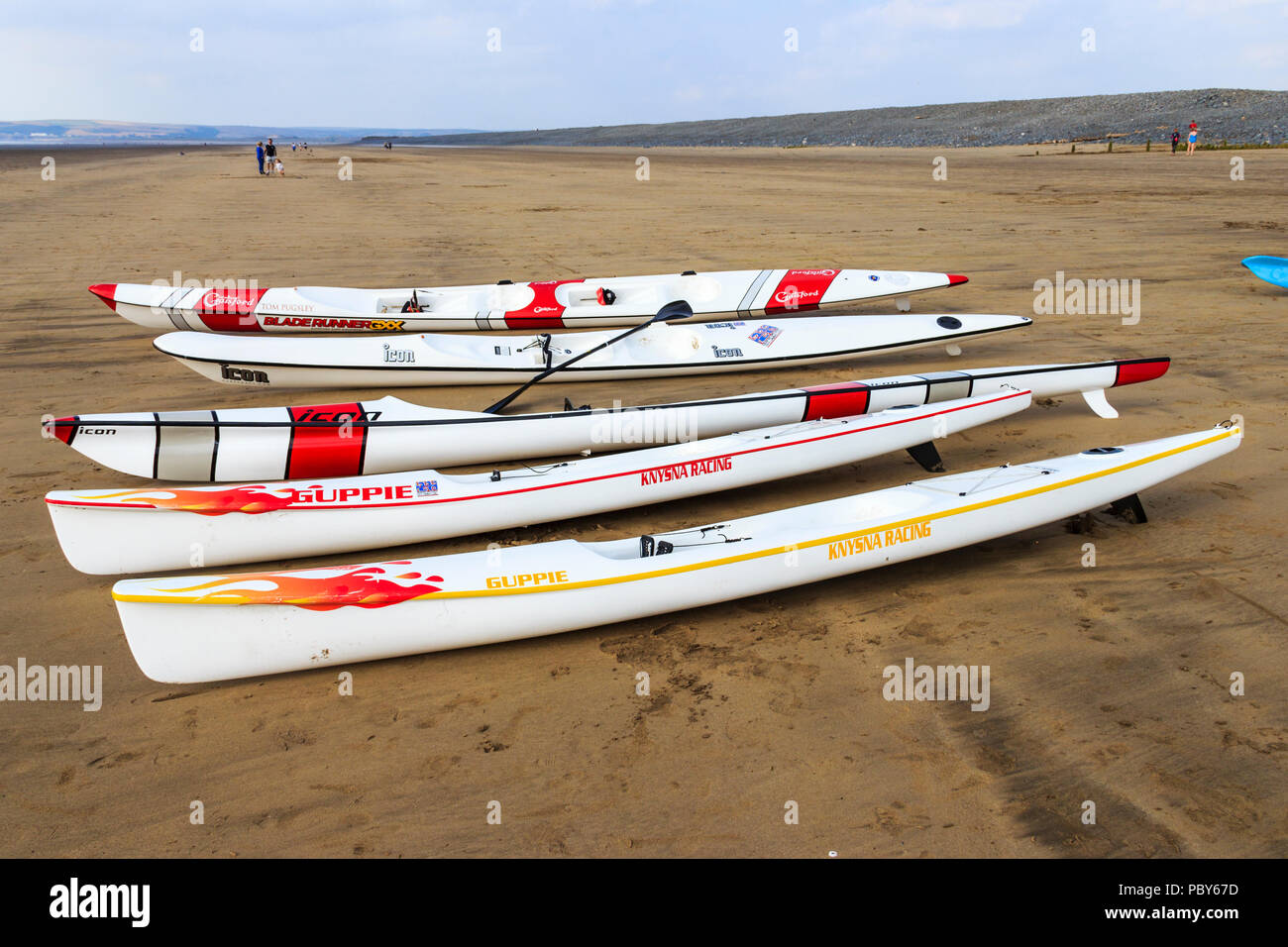 Surf skis and racing kayaks on the beach at Westward Ho!, Devon, UK Stock Photo