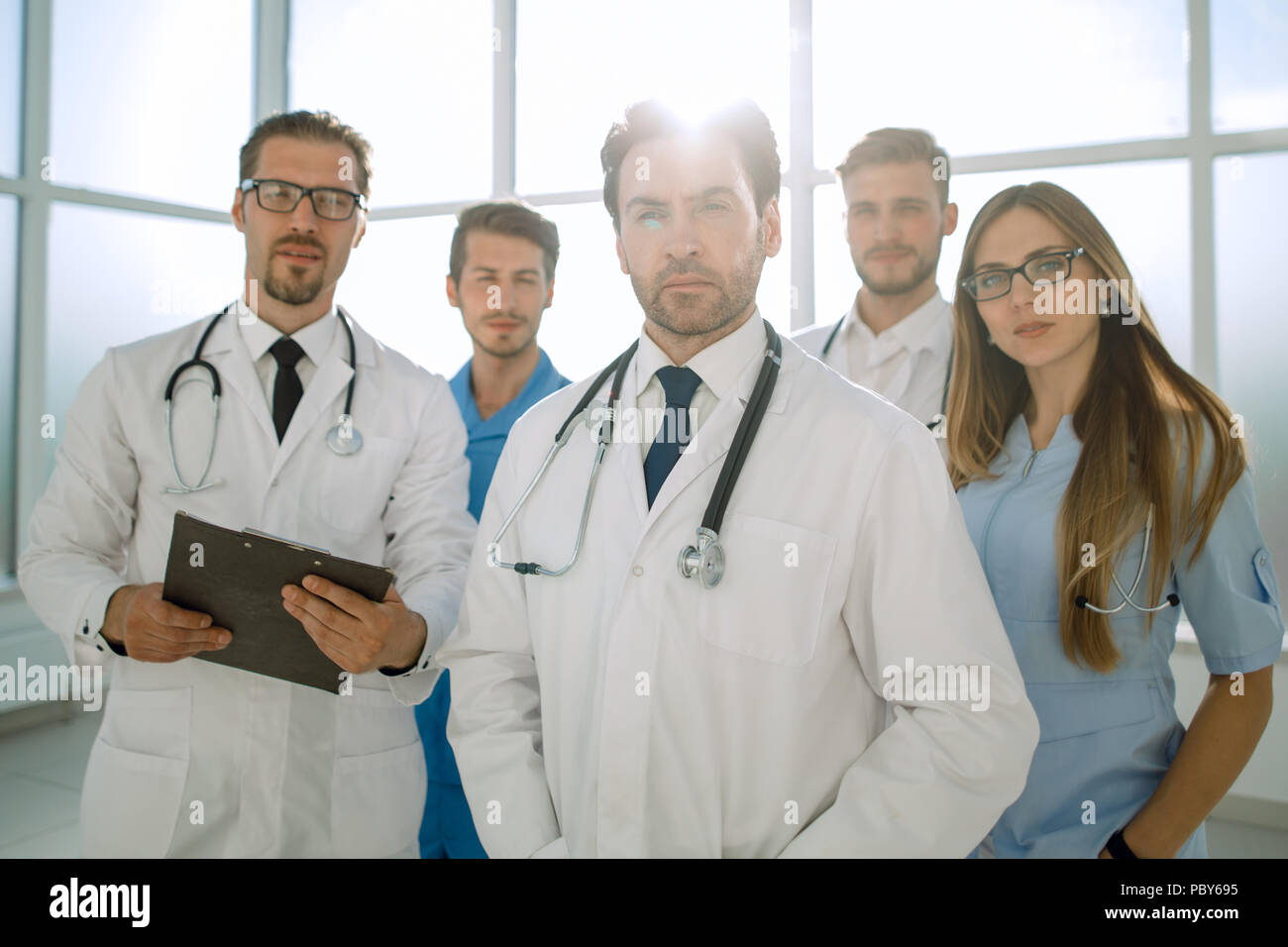 Young doctors looking at camera Stock Photo Alamy