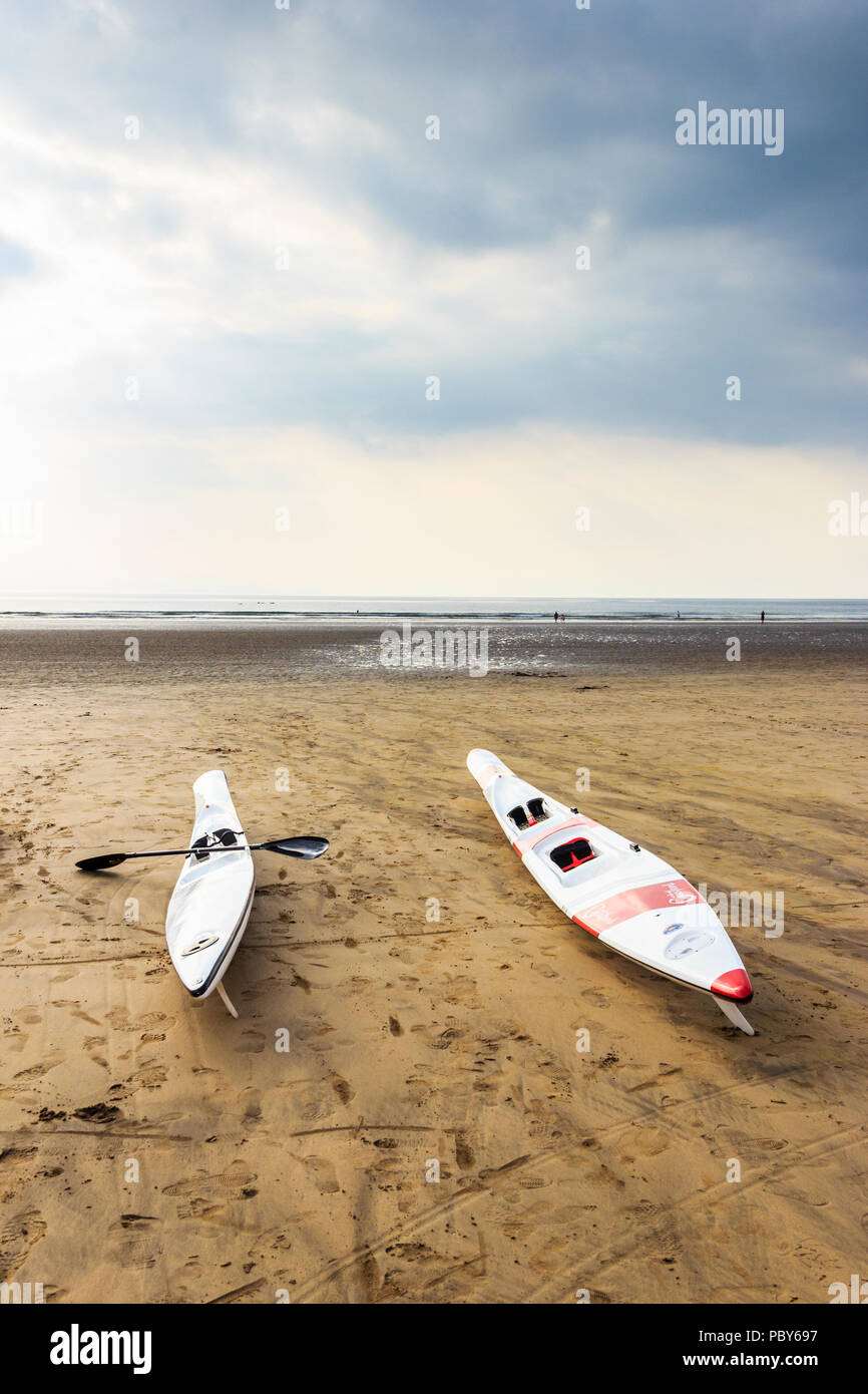 Surf ski and racing kayak on the beach at Westward Ho!, Devon, UK Stock Photo