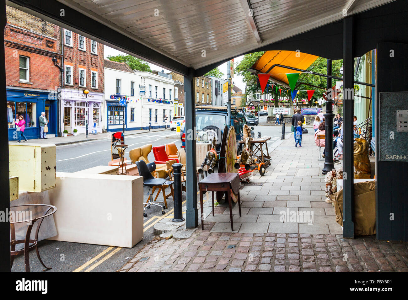 Retro bric-a-brac, toys and furniture outside a shop in Highgate Village, London, UK Stock Photo