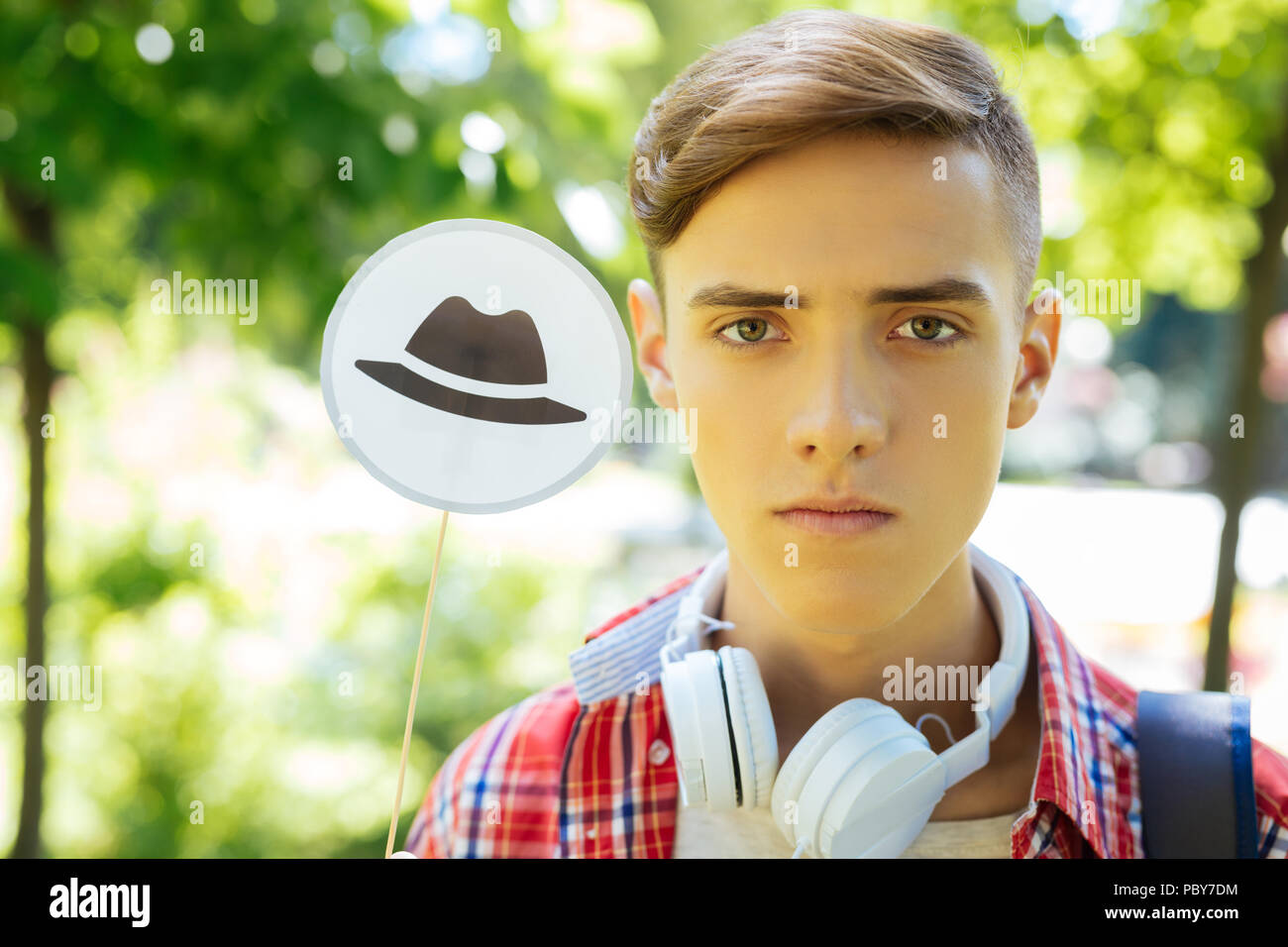 Green-eyed progressive student using technique of thinking hats Stock Photo