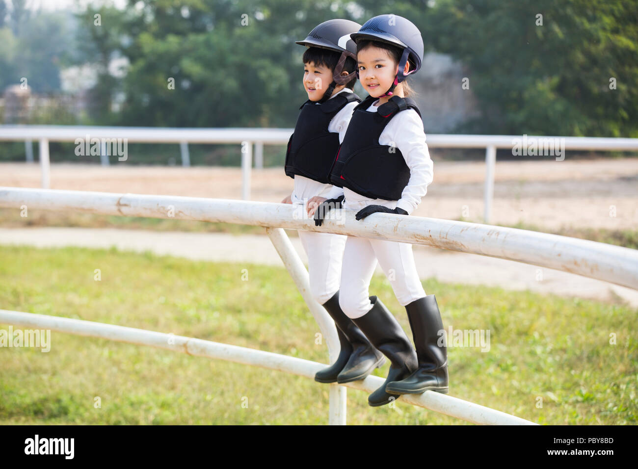 Little Chinese children taking part in equestrian club Stock Photo