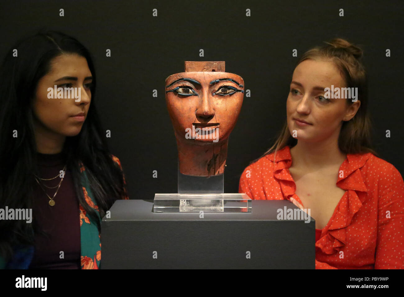 Old master & British paintings and drawings, decorative arts, sculptures and antiquities spanning over two Millennia on auction at Sotheby’s London.  Featuring: Two women looks at Ab Egyptian polychrome Wood Mummy Mask, 21st/22nd Dynasty, 1075-716 B.C (Est £100, 000 - 150, 000). Where: London, United Kingdom When: 29 Jun 2018 Credit: Dinendra Haria/WENN Stock Photo