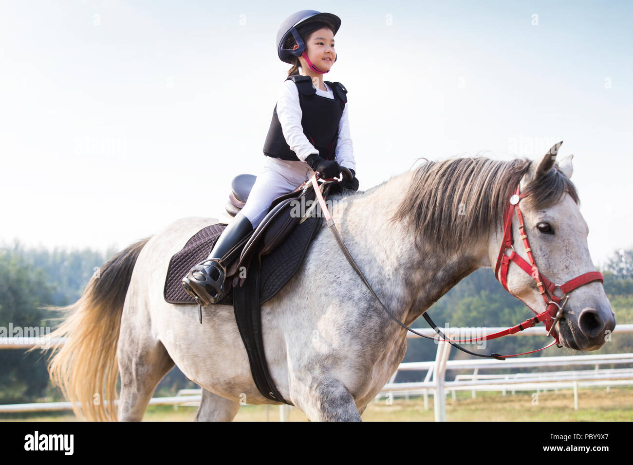 Chinese girl horse riding on hires stock photography and images Alamy