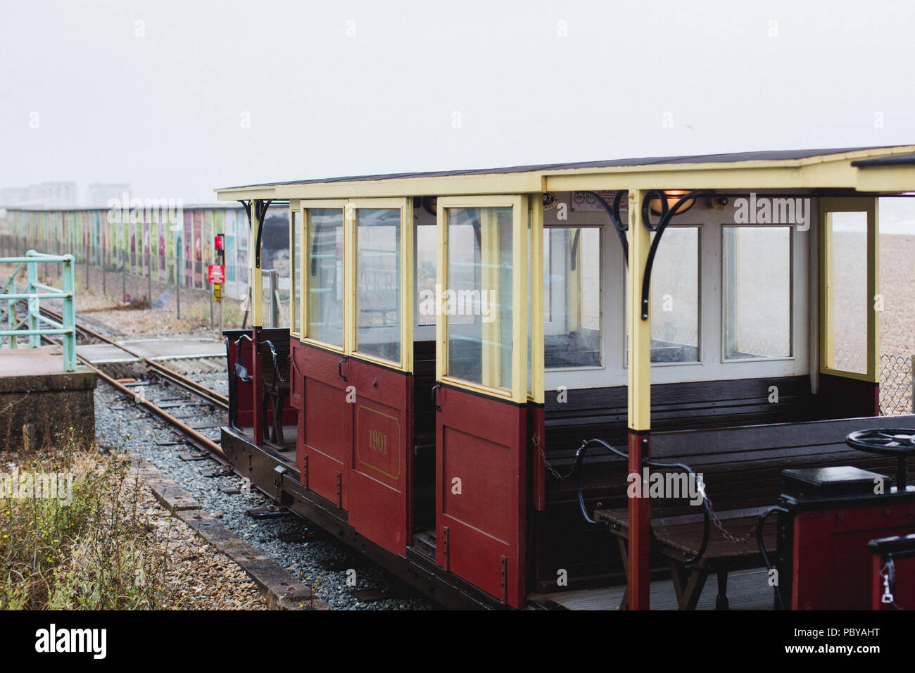 Volk's Electric Railway, Britain's oldest electric railway, still operating on a wet day at the beach in Brighton Stock Photo