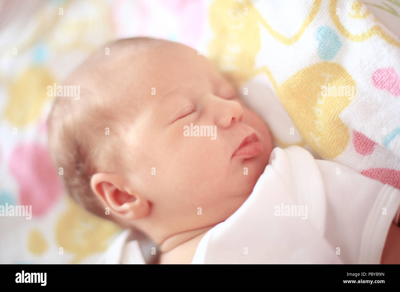 Newborn Baby Sleeping In The Crib On A Blanket Stock Photo