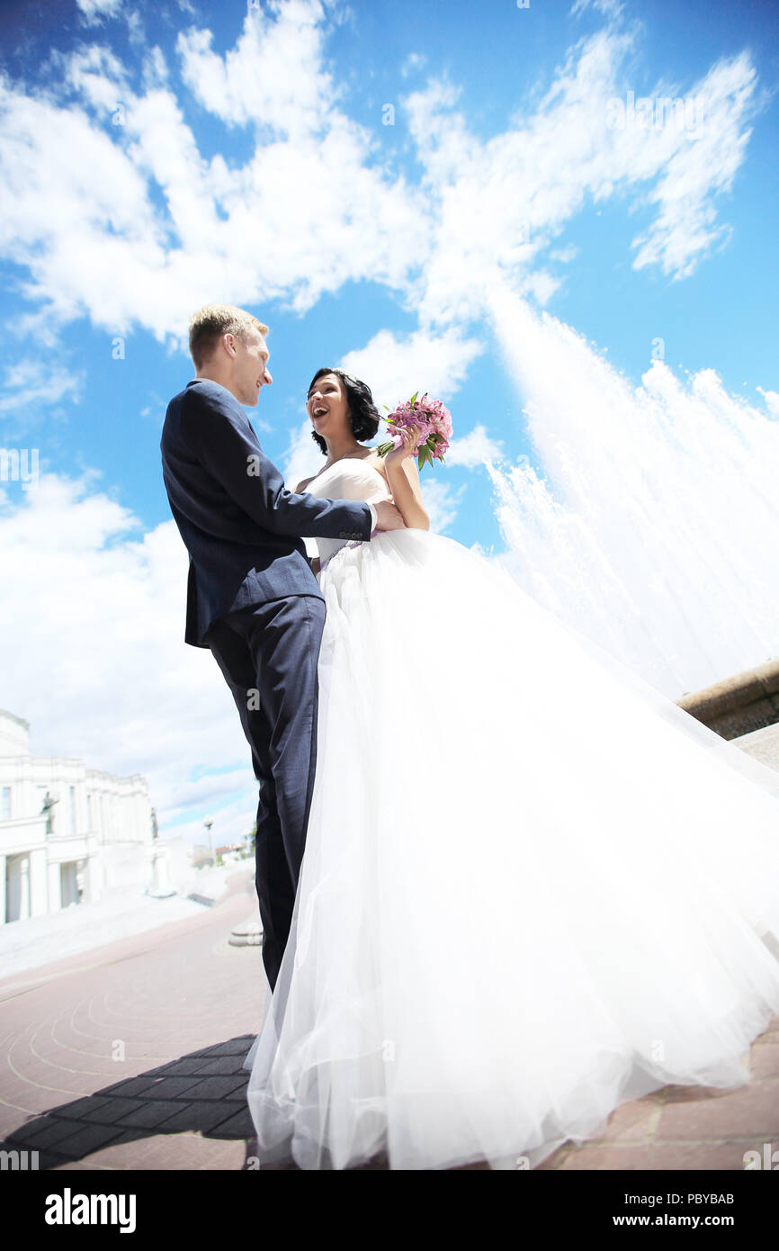 Bride and groom standing together under the blue sky Stock Photo - Alamy
