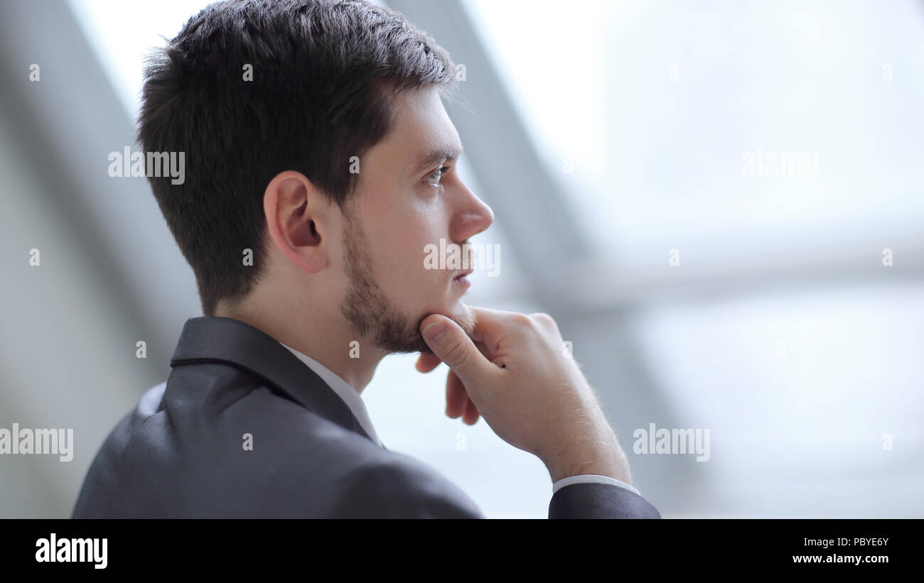 close up.Businessman looking through his office window Stock Photo
