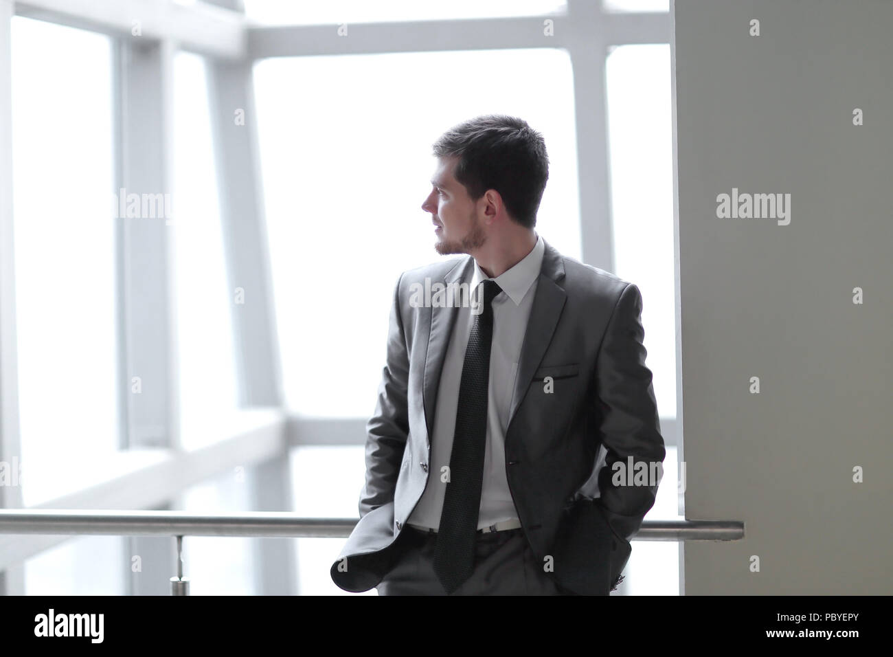 Man In Building successful businessman standing in the lobby of a modern office Stock ...