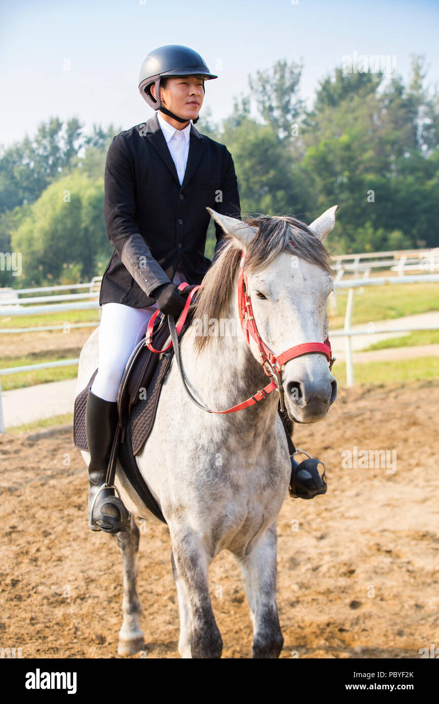 Young Chinese Man Riding Horse Stock Photo Alamy