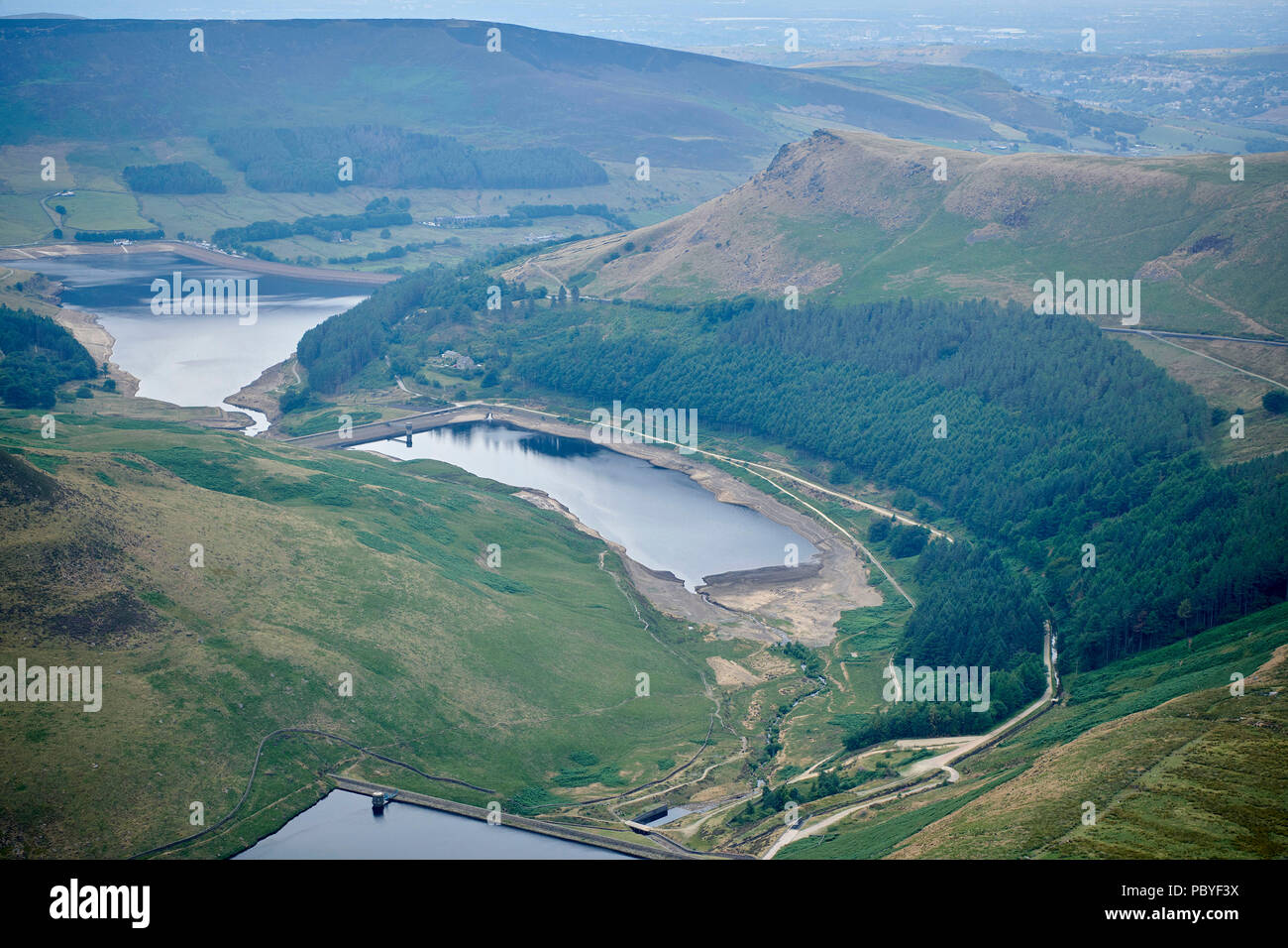 Depleted reservoirs near Greenfield, North West England, UK, in the hot summer of 2018 Stock Photo