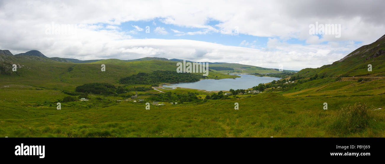 Dunlewey or Dunlewy is a small Gaeltacht village in the Gweedore area of County Donegal, Ireland. It sits in the Poisoned Glen, at the foot of Mount E Stock Photo