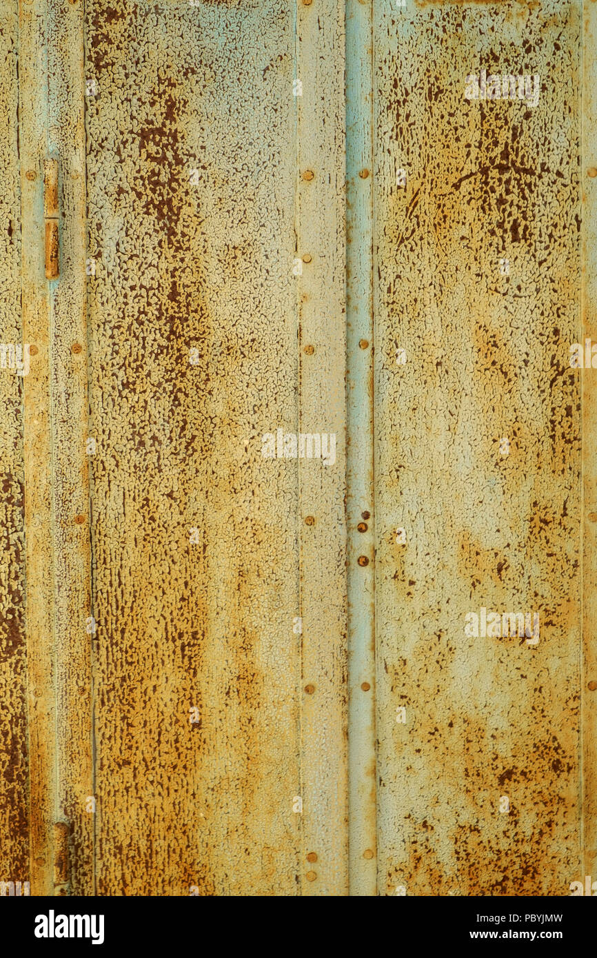 Rusty painted metal shutters full frame background texture Stock Photo