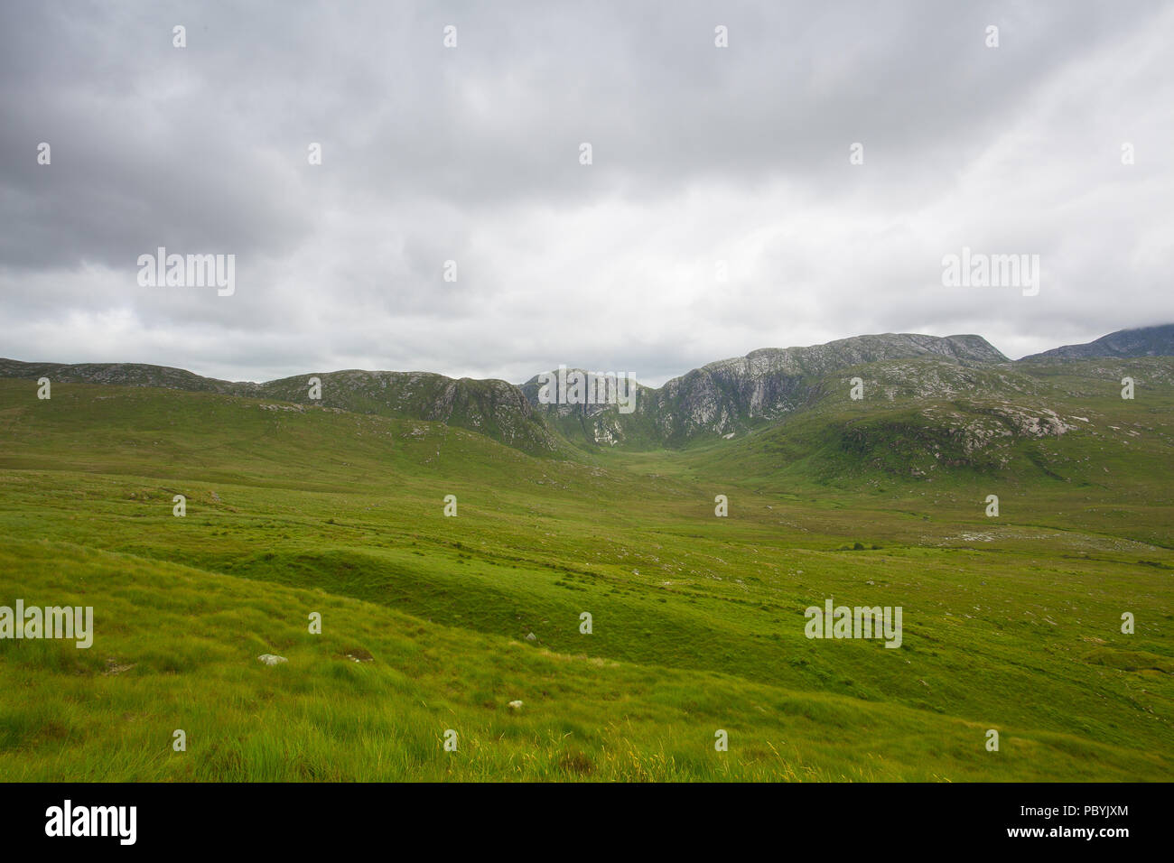 Landscape in Dunlewey or Dunlewy. It is a small Gaeltacht village in the Gweedore area of County Donegal, Ireland. It sits in the Poisoned Glen, at th Stock Photo