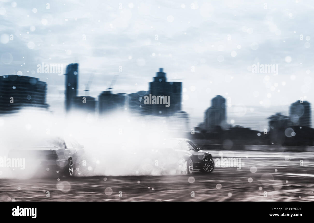 Sport car wheel drifting. Blurred of image diffusion race drift car with lots of smoke from burning tires on speed track. Sport concept,Drifting car c Stock Photo