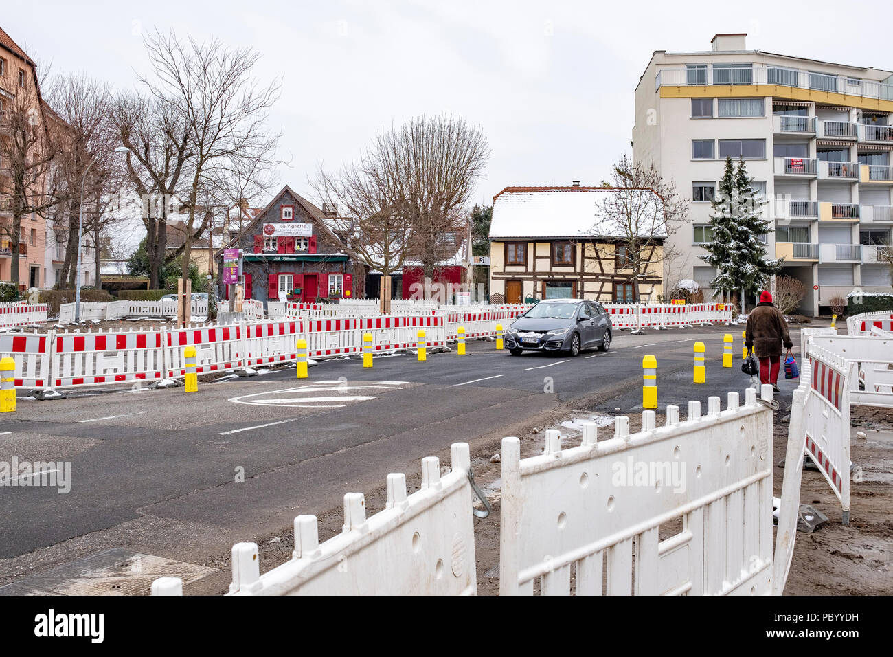 Strasbourg, preliminary tram construction site, line E extension, safety plastic barriers, street, car, houses, Alsace, France, Europe, Stock Photo