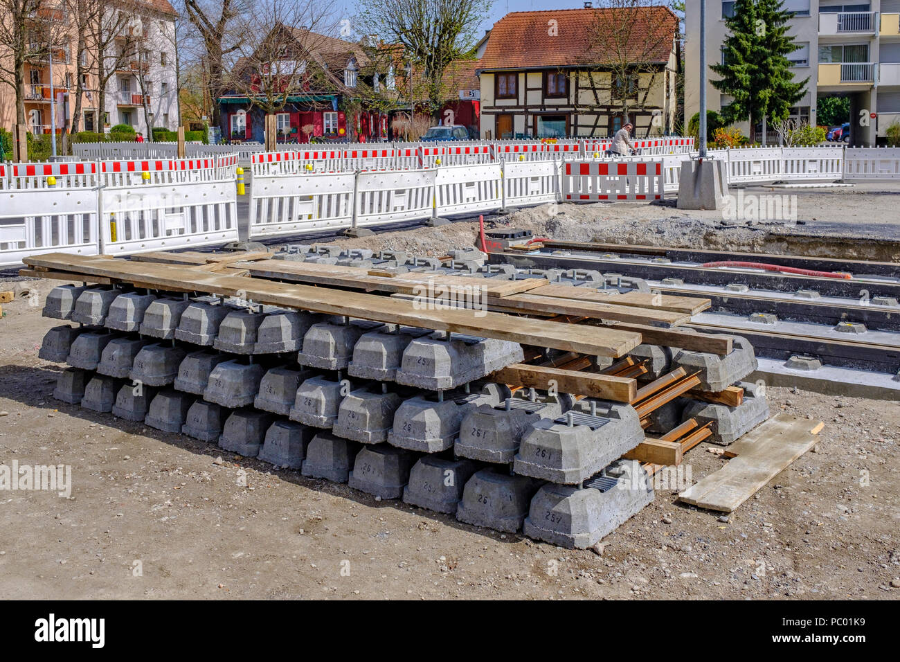 Strasbourg, tram construction site, stacked railway sleepers, rail track pile, safety plastic barriers, line E extension, Alsace, France, Europe, Stock Photo