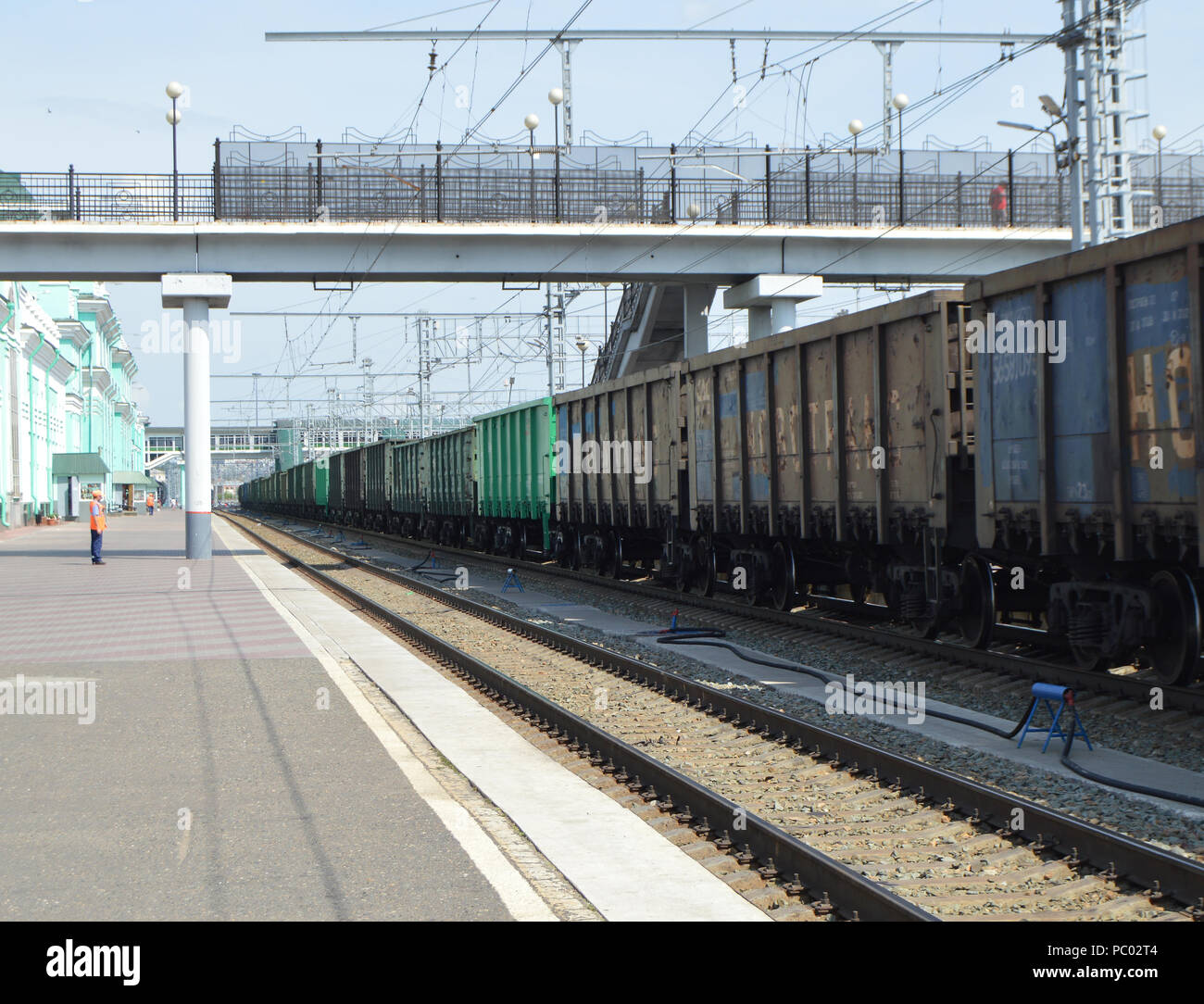 rail freight cars moving on rails along the big station Stock Photo - Alamy