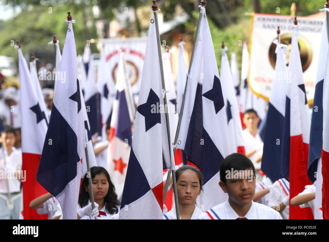 PENONOME, PANAMA, NOV 4th 2016:  School kids carrying the Panamanian flag  during the celebration of separation from Colombia Parade. Stock Photo