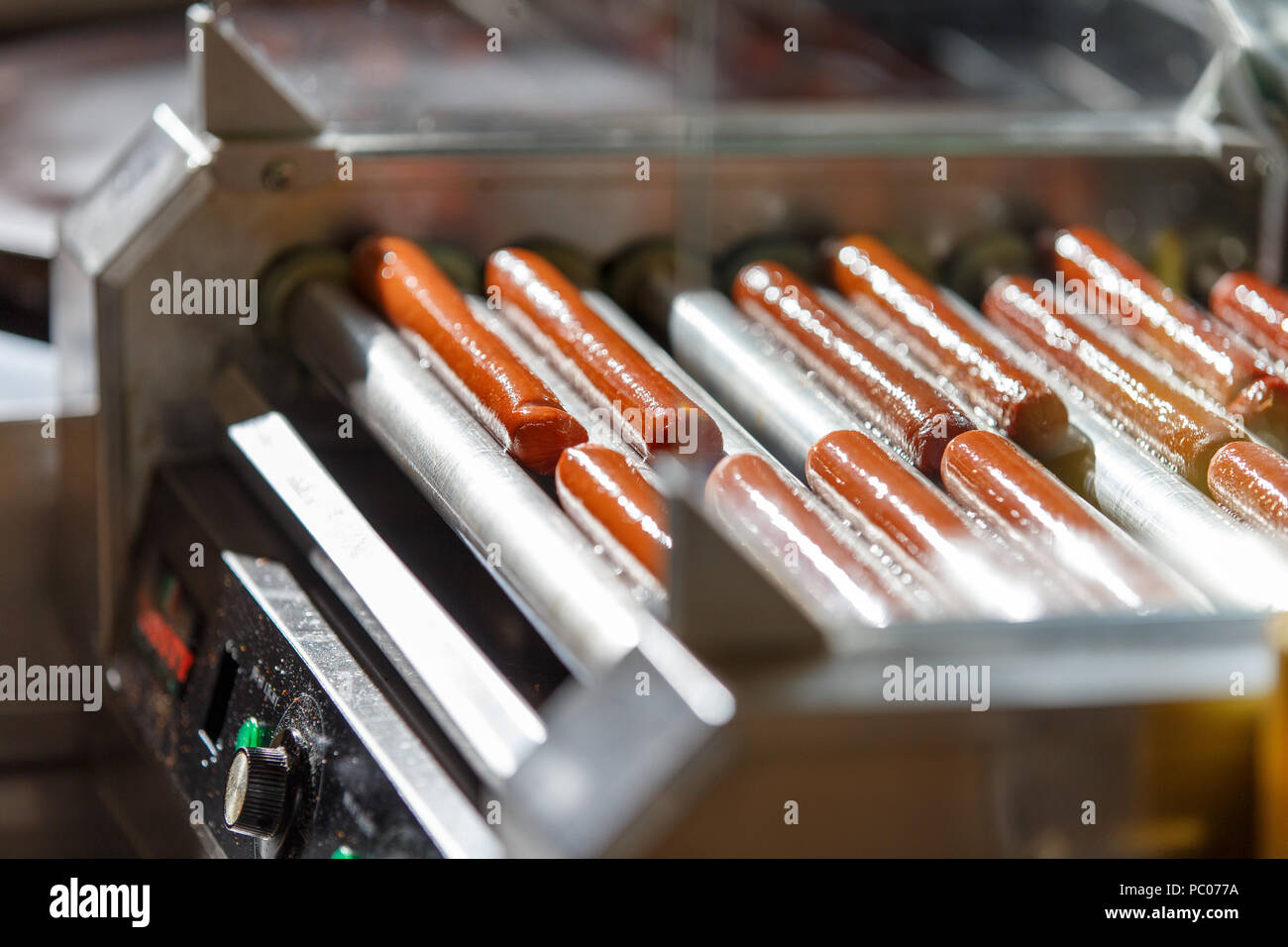 Greasy Hot dog sausages on turning cooking machine Stock Photo Alamy