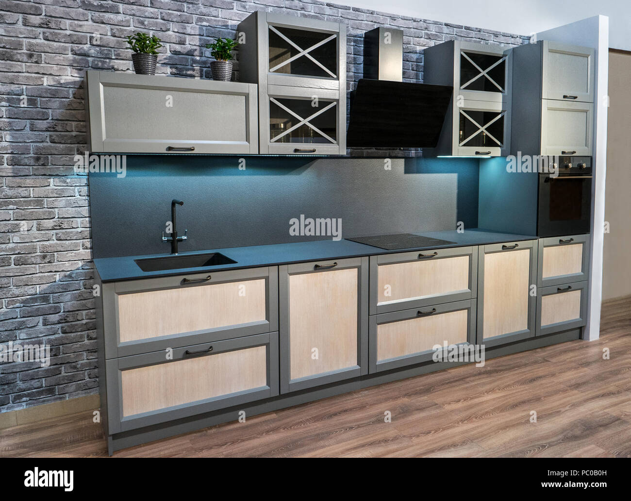 Modern Beautiful New Dark Kitchen Interior In House Stock Photo