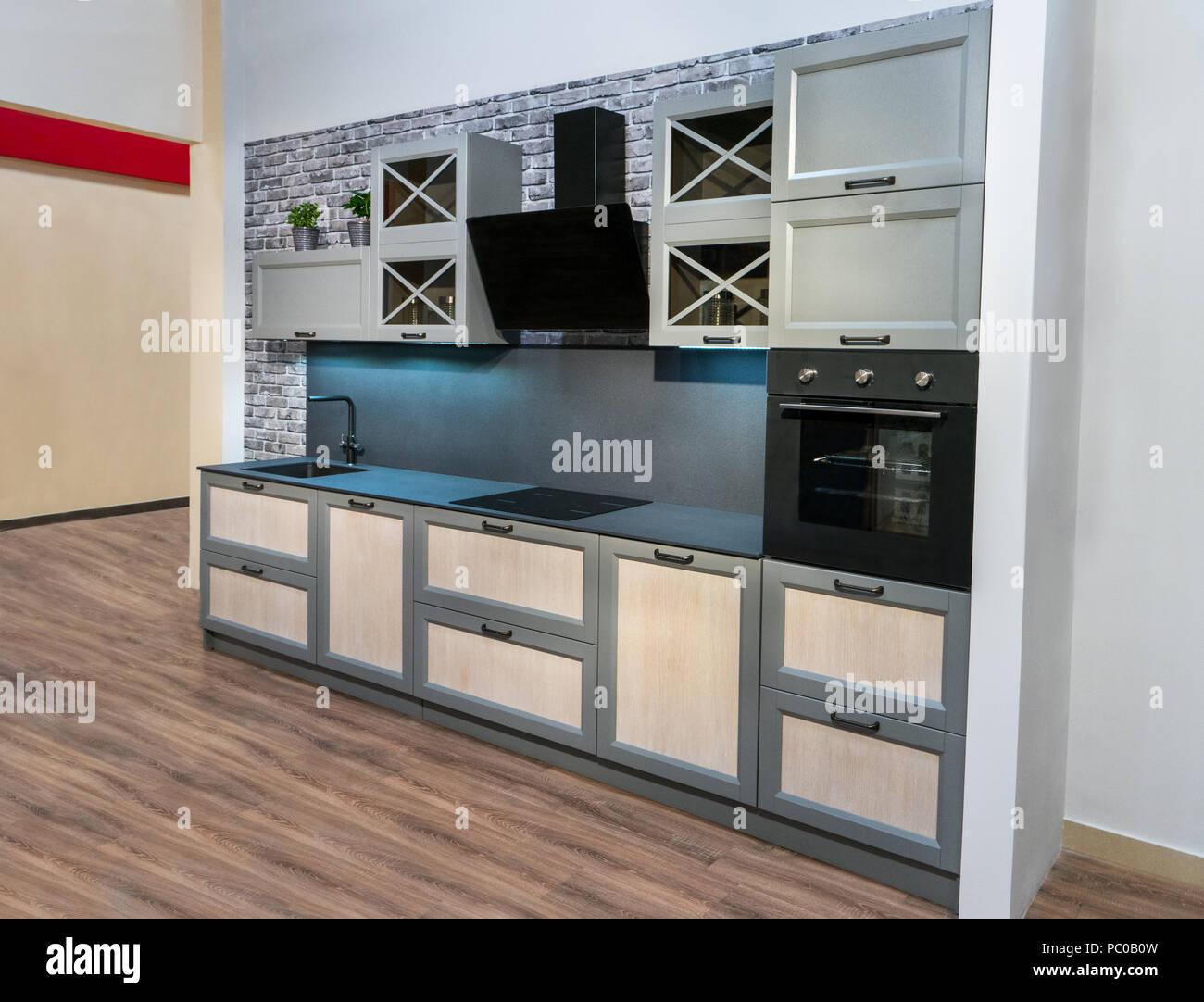 Modern beautiful new dark kitchen interior in house Stock Photo - Alamy