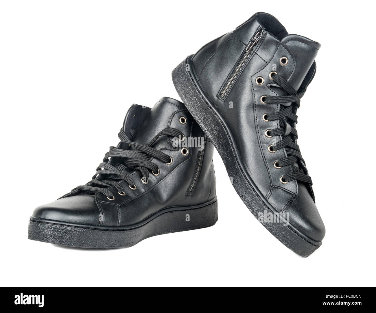 Leather black sneakers isolated on white background Stock Photo - Alamy
