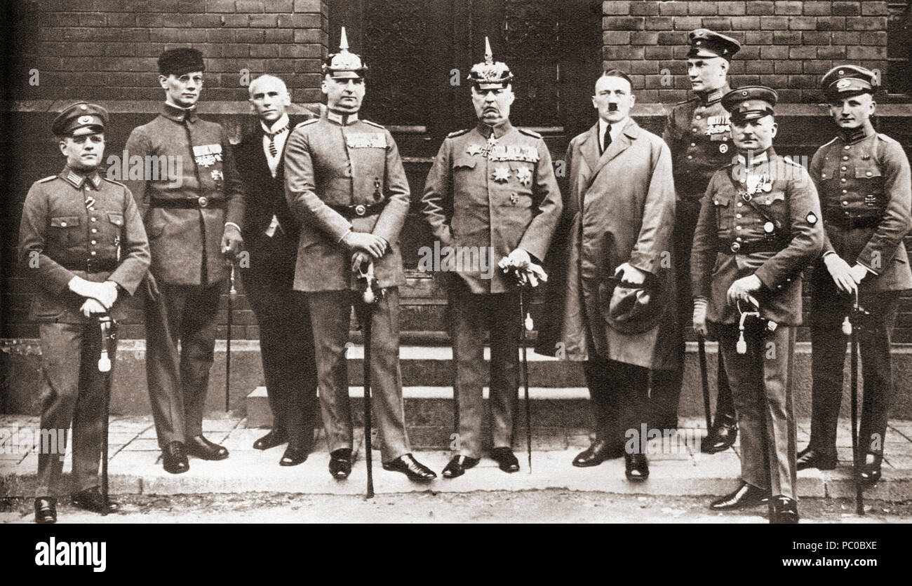 The defendants in the Munich Putsch trial aka Beer Hall Putsch of 1924, a failed coup attempt by the Nazi Party led by Adolf Hitler to seize power in Munich, Bavaria, on 8–9 November 1923.  From left to right: Pernet, Weber, Frick, Kriebel, Ludendorff, Hitler, Bruckner, Röhm, and Wagner.  Adolf Hitler, 1889 – 1945.  German politician, demagogue, Pan German revolutionary and the leader of the Nazi Party.   From These Tremendous Years, published 1938. Stock Photo