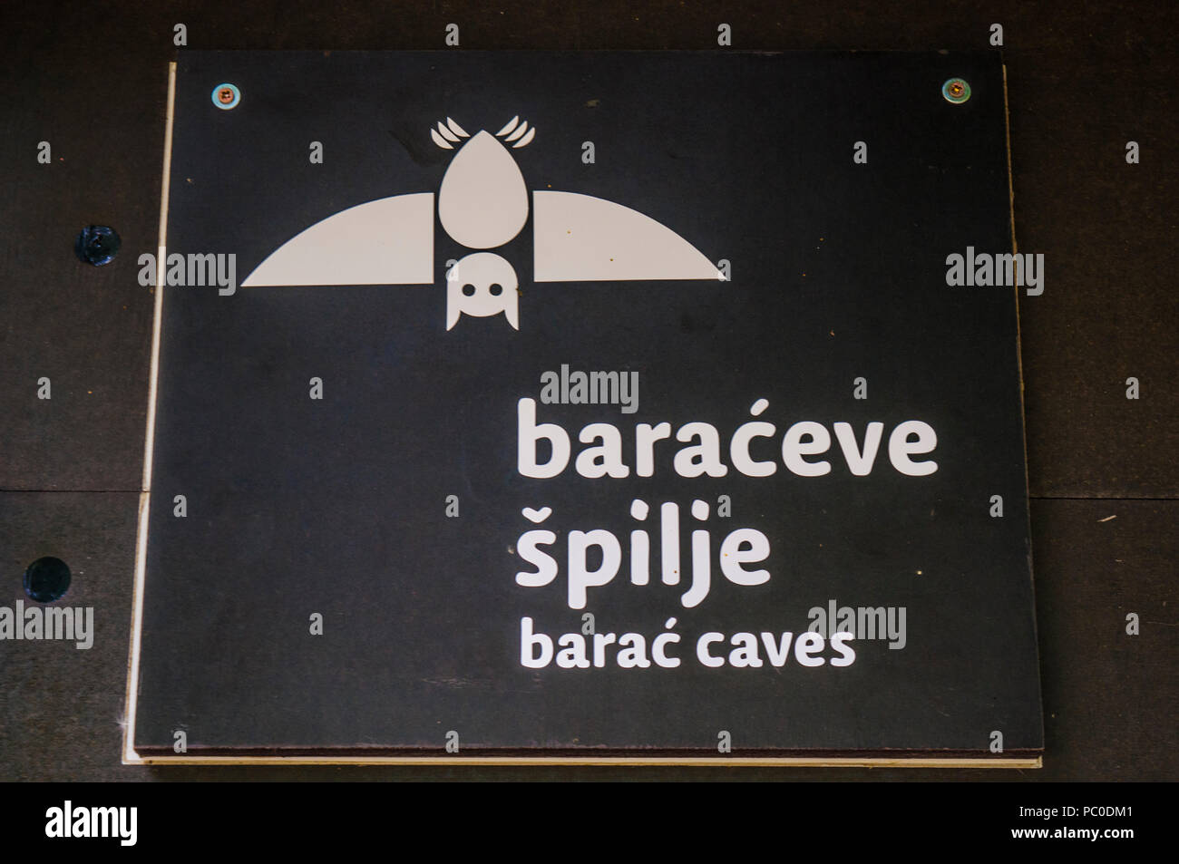 Croatia: the sign of the Caves of Barać (Baraćeve špilje), first recorded in 1699, near the village of Nova Kršlja in the lakes area of Plitvice Stock Photo