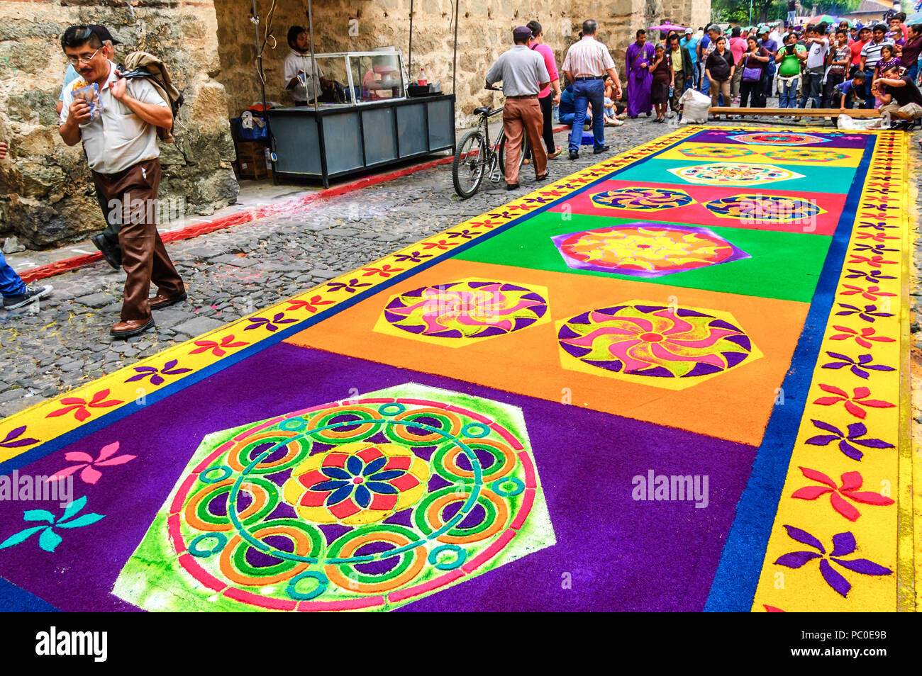 Antigua, Guatemala -  April 2, 2015: Dyed sawdust Holy Thursday procession carpet in town with most famous Holy Week celebrations in Latin America. Stock Photo