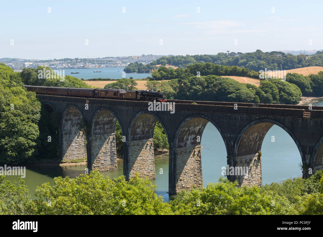 Steam train on railway viaduct at Forder near Saltash Cornwall Stock