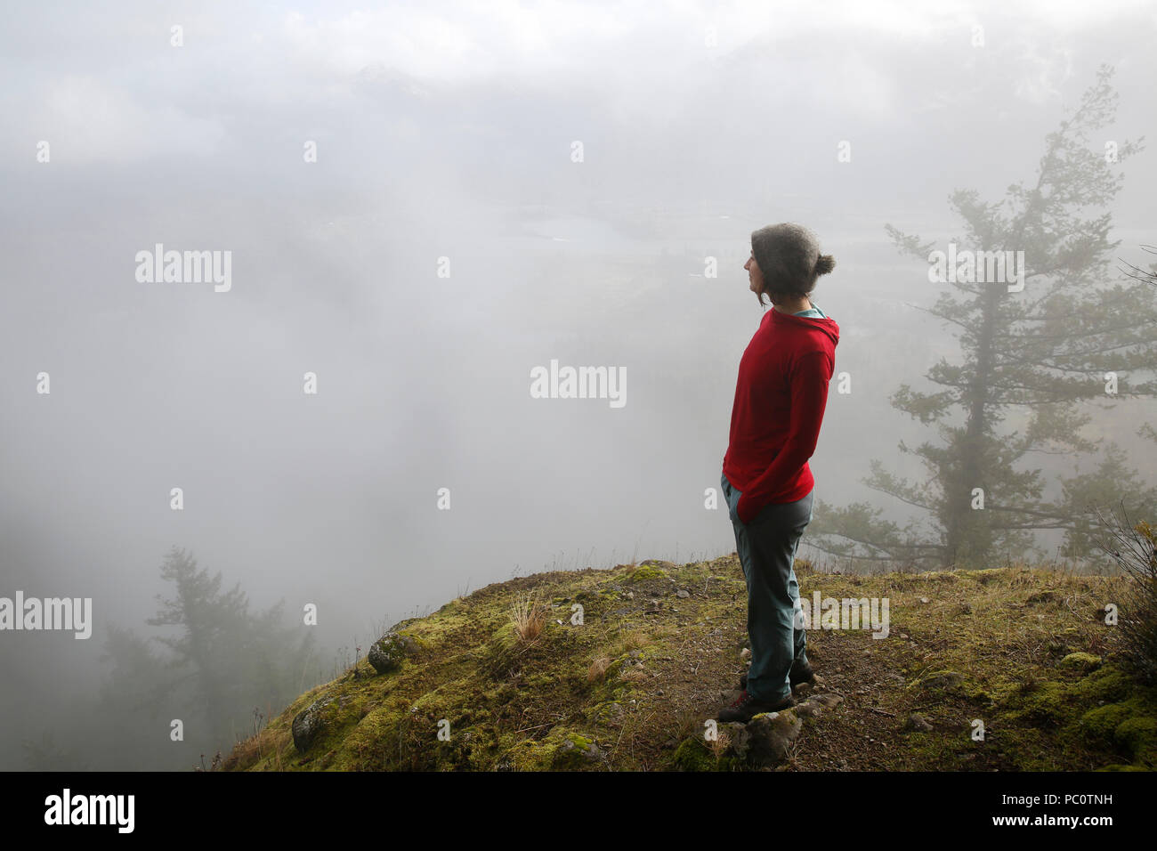 A woman hikes above the Bonneville Dam in the Columbia River Gorge ...