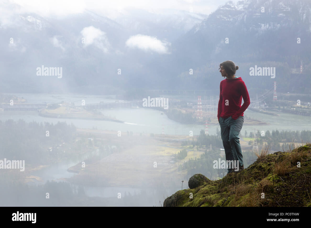 A woman hikes above the Bonneville Dam in the Columbia River Gorge ...